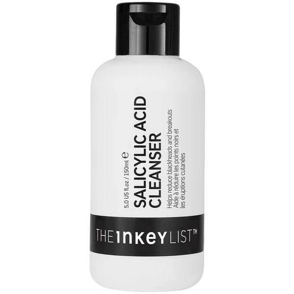 The INKEY List Salicylic Acid Cleanser bottle next to a sink